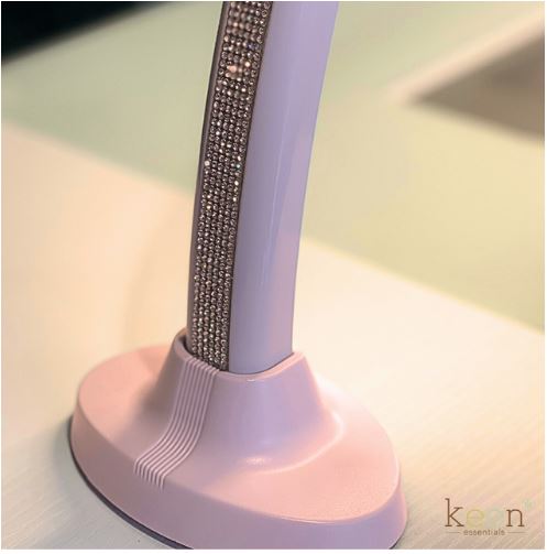 A pink KEEN LUNA LED Tabletop Lamp 9100 with rhinestones on it.